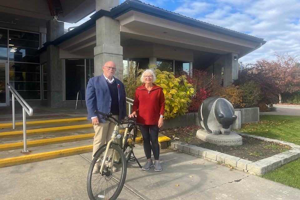 The District of Lake Country offered added incentive for residents to attend their pop ups, a grand prize draw for an e-bike. Mayor Blair Ireland presents draw winner Dori Hewiston with the grand prize, October 29, 2024.