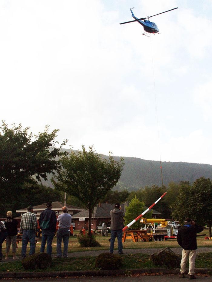 BC Hydro changes poles with helicopter