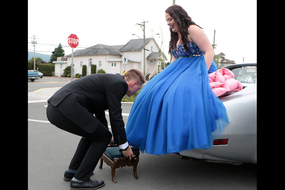 Daylon Hicks is as gentlemanly as he can be as he arrives at the Cowichan Secondary School grad banquet with date Isabelle Paton last Saturday. (Kevin Rothbauer/Citizen)