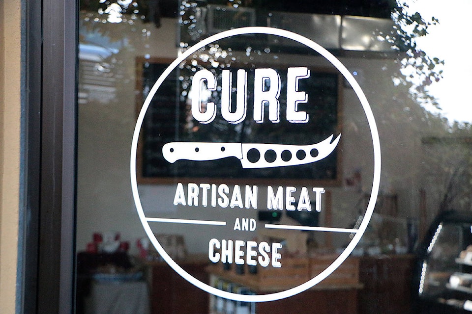 Top right: The front door of Cure Artisan Meat and Cheese at Valleyview Centre in Cobble Hill.