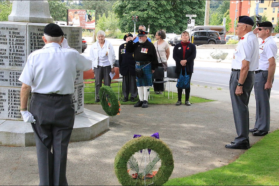 Legion members salute during the singing of ‘O Canada’ at the D-Day ceremony in Duncan June 6. (Lexi Bainas/Citizen)