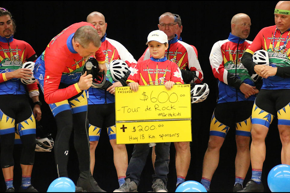 Junior rider, Jaxon, gets a cheer at Lake Cowichan School for collecting money for Cops for Cancer Tour de Rock. (Lexi Bainas/Citizen)