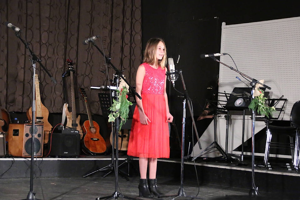 Elly Hamilton sings ‘I Want a Hippopotamus for Christmas’ to open the show at Cobble Hill Hall on Sunday, Dec. 9. (Lexi Bainas/Citizen)