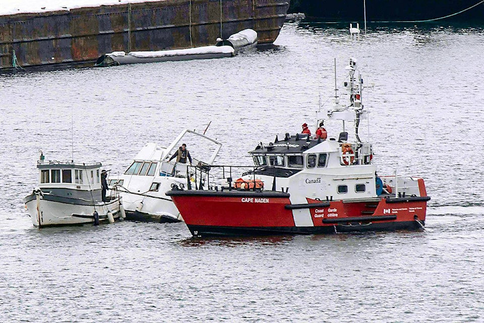 15757753_web1_coast-guard-ship-checks-out-Cow-Bay-boat