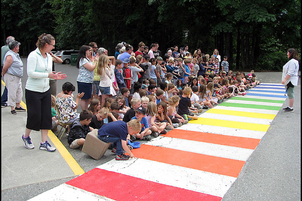 Palsson Elementary School students turn our in force to admire the rainbow crosswalk created at their school by Mr. Battye’s Social Justice Class from Lake Cowichan School. (Carolyne Austin photo)