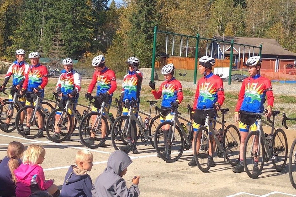 Tour de Rock Riders line up to visit with staff, students and parents at Palsson Elementary in Lake Cowichan Tuesday. (Sarah Simpson/Citizen)