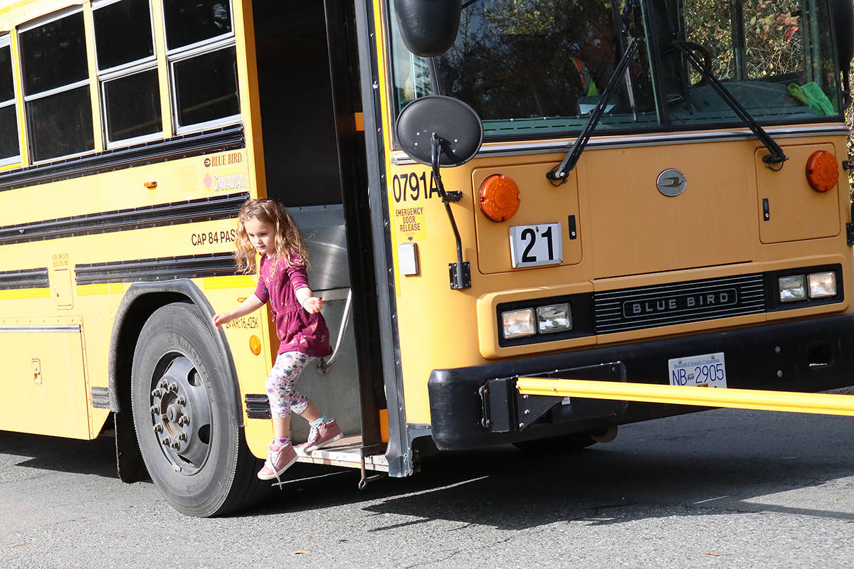 19056405_web1_kid-out-of-bus-1