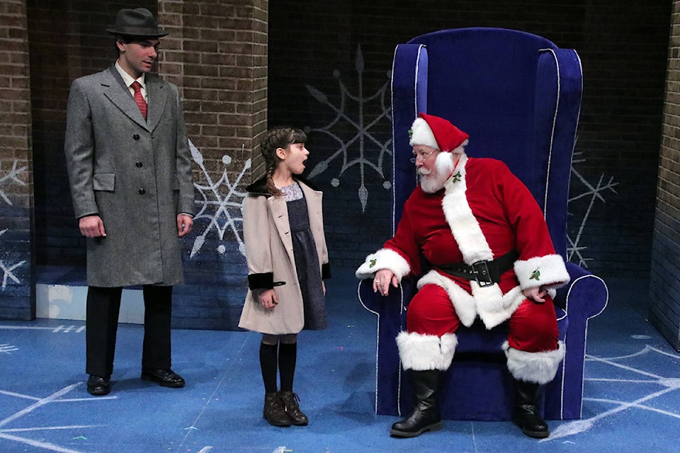Susan Walker (Kaia Russell) doesn’t look like she’s ready to believe in Santa Claus (Hal Kerbes) just yet despite the best efforts of Fred Gailey (Abraham Asto). (Lexi Bainas/Citizen)