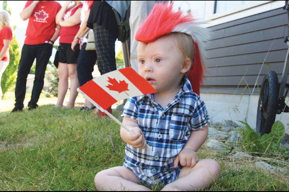 Lake Cowichan town councillor Tim McGonigle’s little grandson likes to wave his flag for Canada. (Malcolm Chalmers photo)