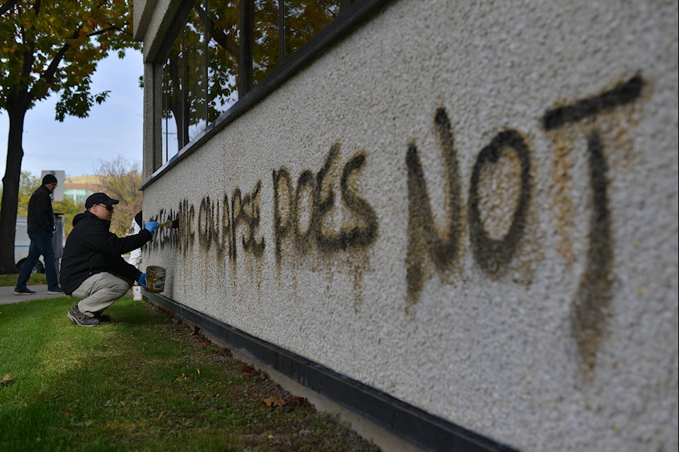 City of Kelowna crews are cleaning city hall after it was vandalized overnight. (Phil McLachlan - Capital News)