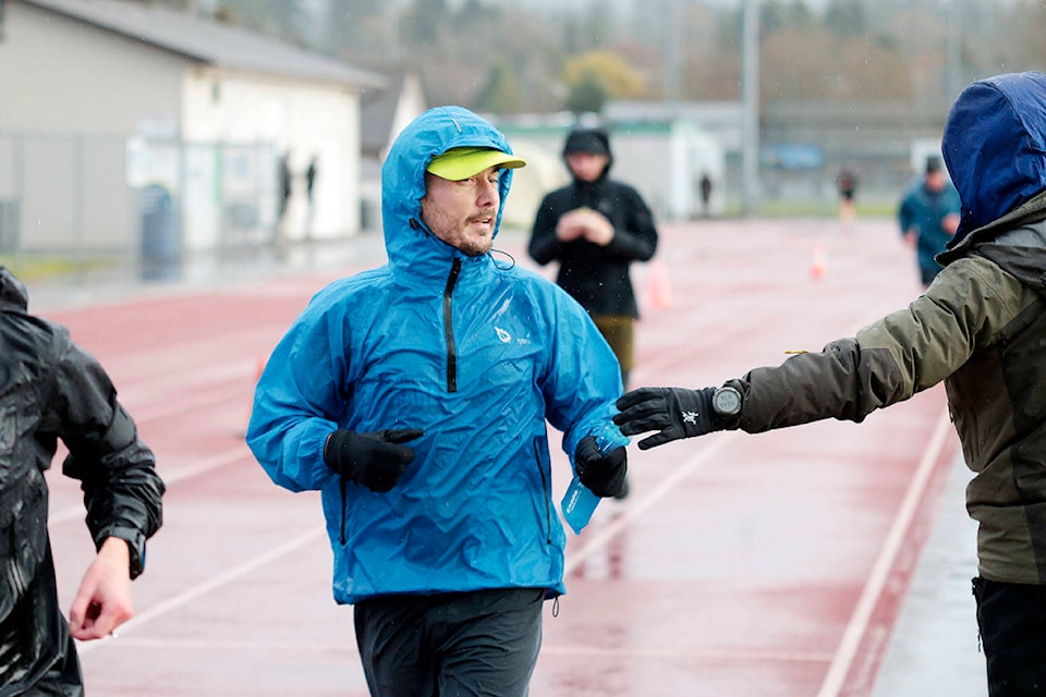 Ultramarathoner Jerry Hughes completes his 100th lap of the Cowichan Sportsplex track on Sunday, Nov. 15, the first day of his bid to break the Canadian six-day running record. (Kevin Rothbauer/Citizen)