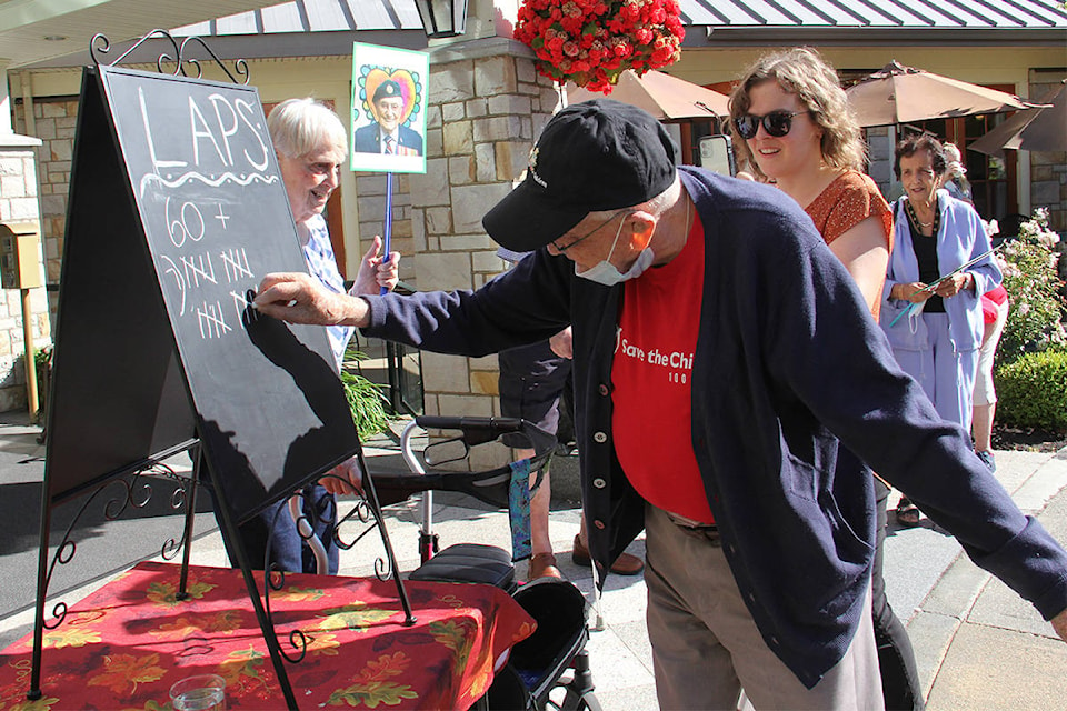 John Hillman, 102, marks down the last lap for the day hitting 80 on July 6. (Christine van Reeuwyk/News Staff)