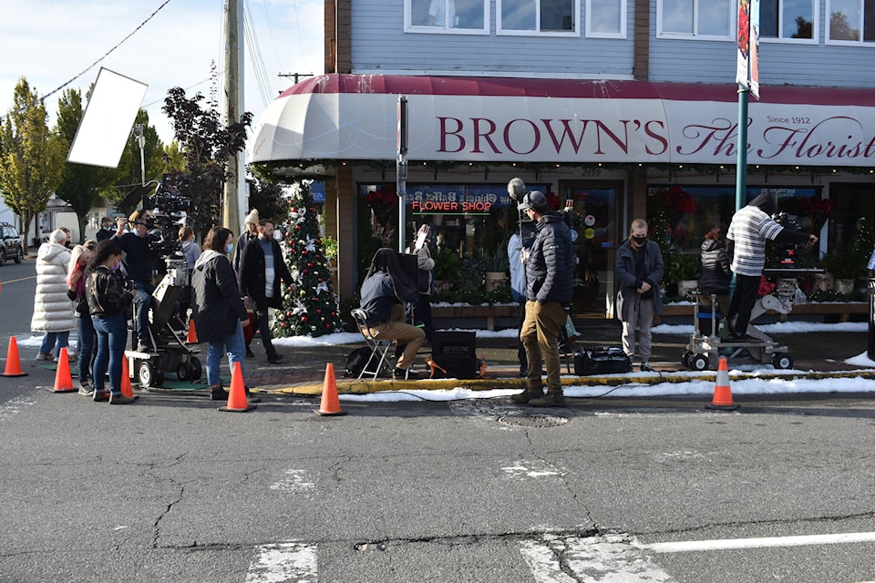 Crews and cast shooting The Christmas House II in Sidney crowded the corner of Second Street and Beacon Avenue Wednesday morning Robert Buckley and Mattia Castrillo are among the actors in the Hallmark Channel movie. (Wolf Depner/News Staff)