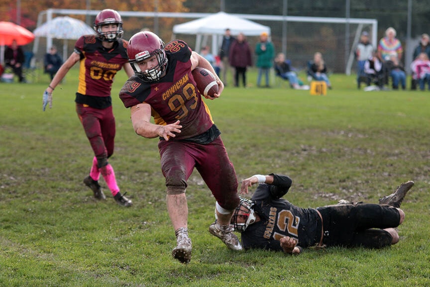 Jayden Strzok escapes from a Victoria Spartans tackler during the midget Cowichan Bulldogs’ 29-0 win at McAdam Park last Sunday. (Kevin Rothbauer/Citizen)