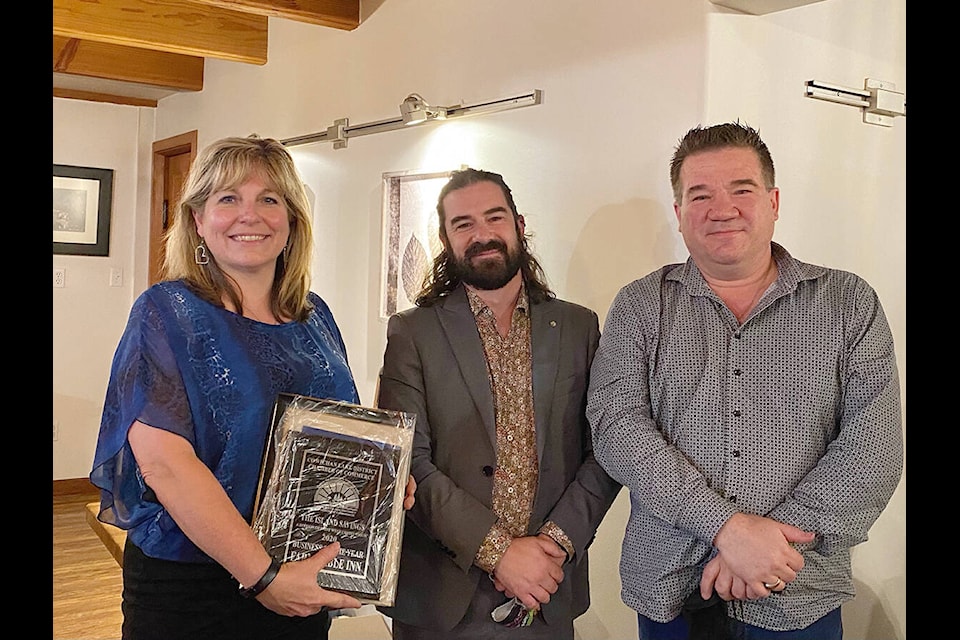 Top: The Farm Table Inn has won the Business of the Year Award in the 2020 Cowichan Lake District Chamber of Commerce’s Business & Community Excellence Awards. Pictured are owners Evelyn Koops and George Gates with presenter James Funfer (centre), manager of Lake Cowichan’s Island Trust. (Lauri Meanley/Gazette)
