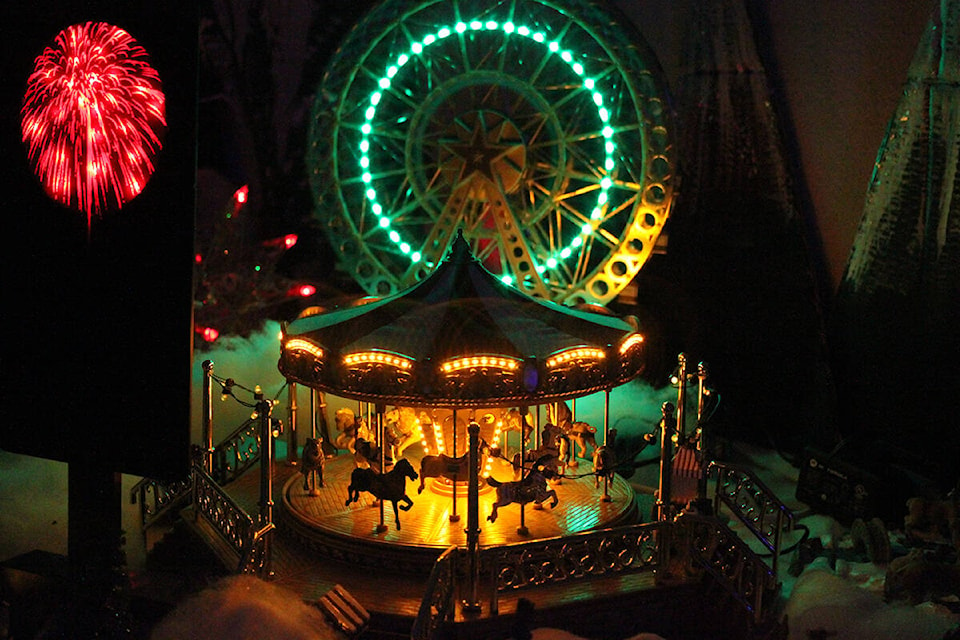 A carousel and Ferris wheel are two of the star attractions in the Christmas village display at Cassy’s Coffee House in Youbou. (Andrea Rondeau/Gazette)