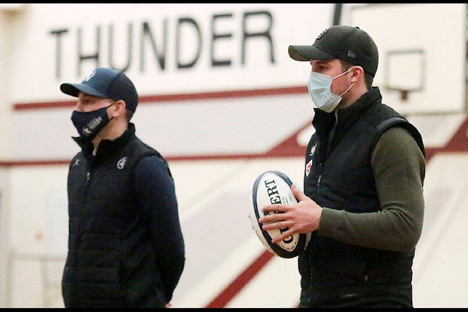 MacDowell Rugby Academy founder Robin MacDowell and national men’s rugby sevens player Pat Kay, both graduates of Cowichan Secondary, speak to students at the high school on Wednesday, Feb. 17 about the new academy program that debuted in the fall. (Kevin Rothbauer/Citizen)