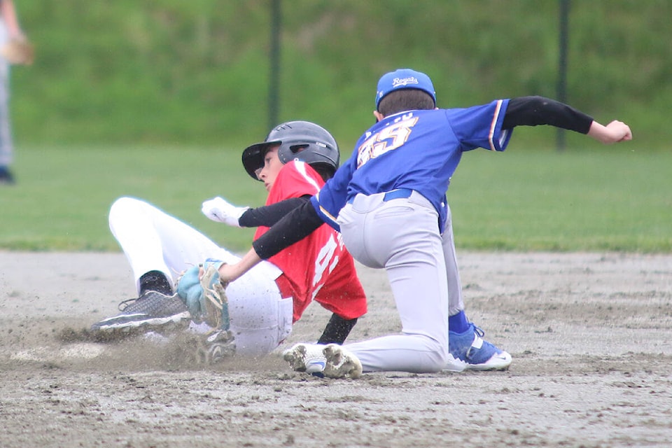 Jackson Lange slides safely into second base during the U15 Cowichan Valley Mustangs’ win over the Ridge Meadows Royals at Evans Park on Saturday, May 14. (Kevin Rothbauer/Citizen)