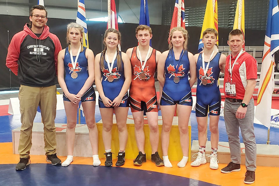 Some of the Cowichan Valley Wrestling Club’s national championship medallists. From left: coach Ryan Yewchin, Loryn Roberts, Sedona Bond, Darren Doherty, Emma Greenwood, Carter Zuback and coach Nick Zuback. (Submitted by the Cowichan Valley Wrestling Club)