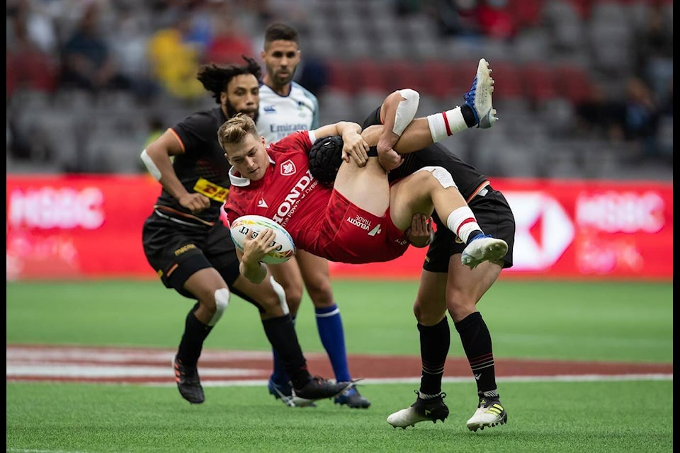 Canada’s Ciaran Breen, front, is tackled by Germany’s John Dawe during HSBC Canada Sevens rugby action, in Vancouver, B.C., Saturday, Sept. 18, 2021. THE CANADIAN PRESS/Darryl Dyck