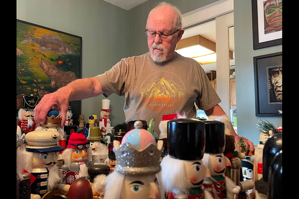 Kenn Whiteman takes a trip down memory lane sorting through his collection of 263 nutcrackers in his dining room. The collection takes up three rooms in his home. (SUSAN QUINN/ Alberni Valley News)