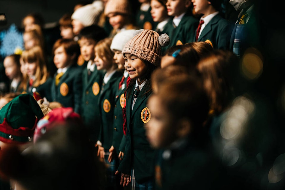 Choir and band students at Queen Margaret’s School perform in their holiday concert before Christmas, 2022. (Ashley Marston photo)