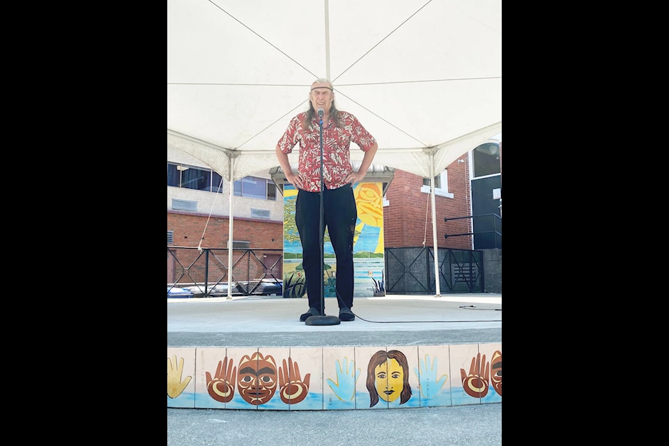 Longevity John Falkner has his mic ready and is eager to kick off this year’s 39 Days of July on June 28. Falkner stands on the City Square stage where there will be 31 concerts in 26 days this year. (Chadd Cawson/Citizen)
