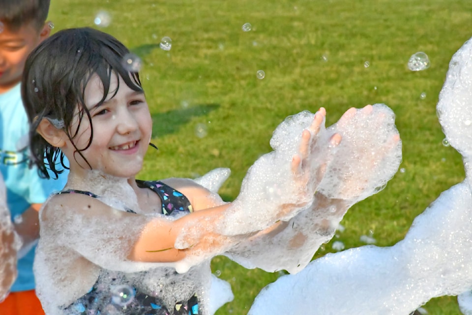 Reign Lindh and other kids in the foam zone were sprayed with foam during the Township Fire Department summer celebration Aug. 8 in Brookswood.