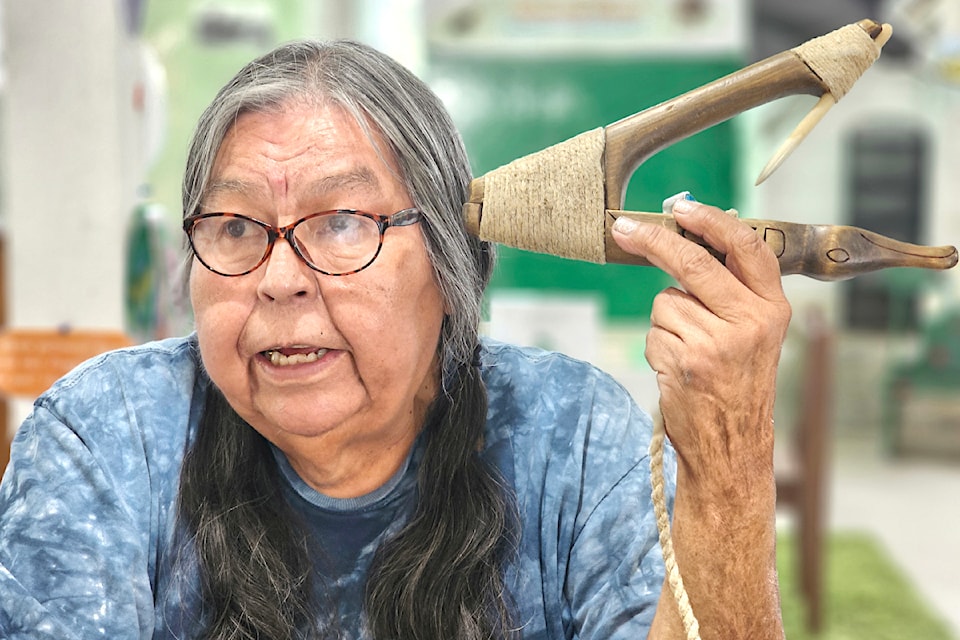 Kwantlen First Nation elder Karen Gabriel held up a traditional halibut hook, part of her presentation of Indigenous tools and technology at Campbell Valley Regional Park's Nature House on Sunday, Aug. 11