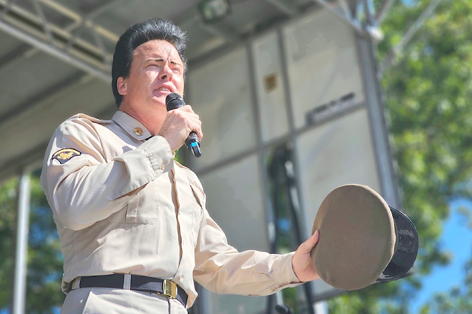 Steve "Elvis Elite" Elliott sang at the third annual Motors and Music fundraiser that drew crowds to the Kwantlen Polytechnic University parking lot in 91ԭ City in August. (91ԭ Advance Times files)
