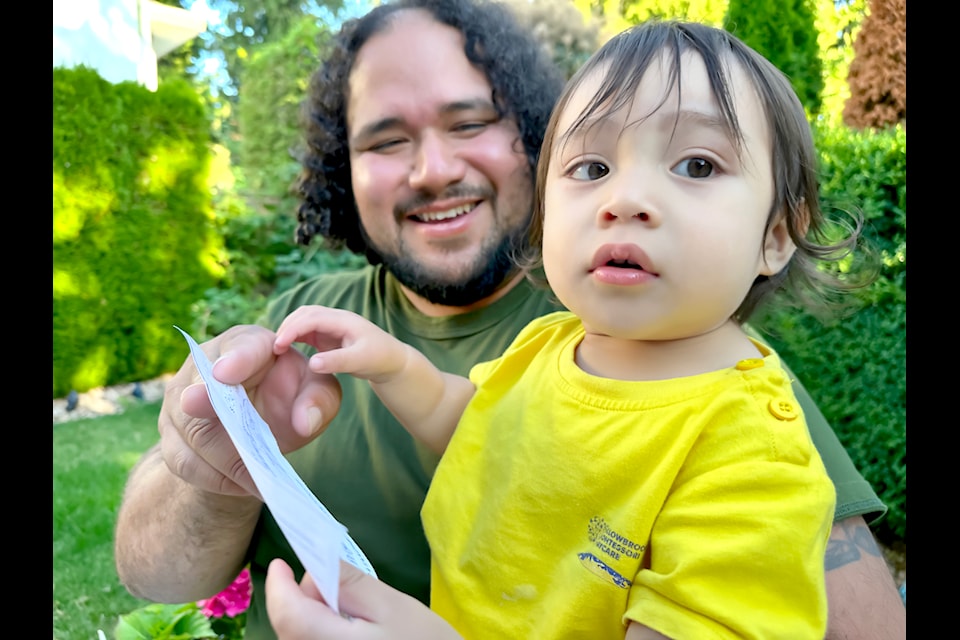 Primo doesn't realize what he's holding. That's the cheque for more than $136,000 from the 91ԭ Rotary 50/50 Mega Draw. His dad, David Mairena, purchased the ticket on behalf of a small group of family. 