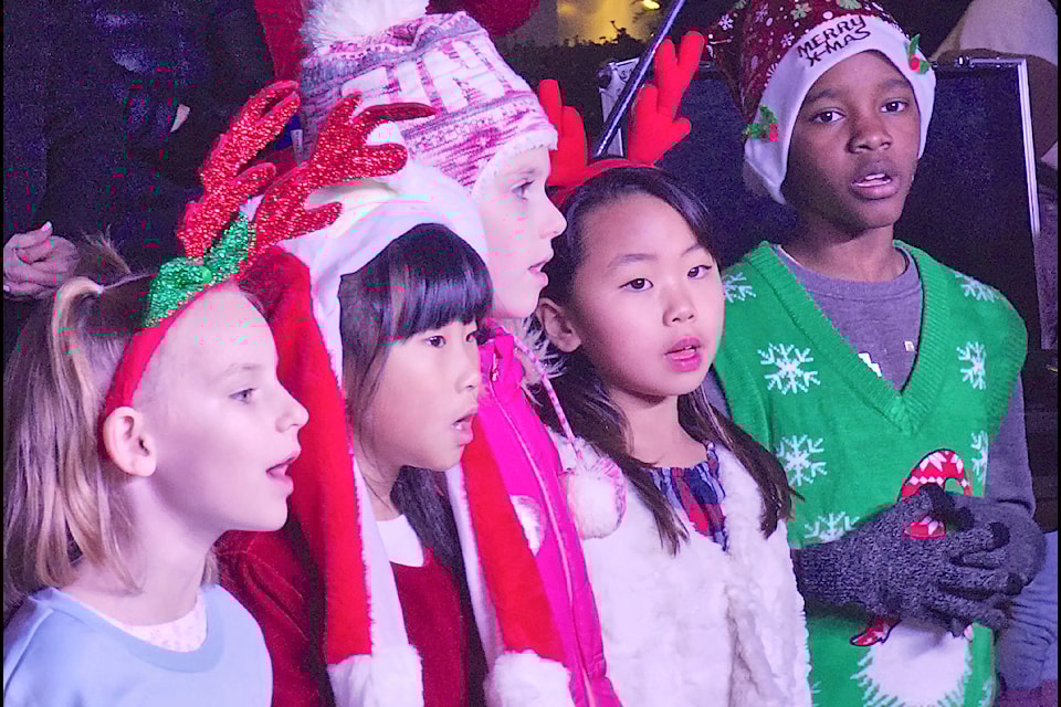 Hundreds filled the front lawn of the historic community hall in Fort 91ԭ for the annual Christmas tree lighting on Saturday, Nov. 30, featuring the 91ԭ Community Music School’s Children’s Choir.