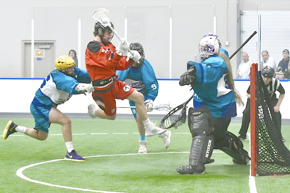Shooting Eagles goaltender Brody Harris makes a save on Grizzlies' Erik Forsselius during Arena Lacrosse League West action at 91ԭ Events Centre on Dec. 7. 