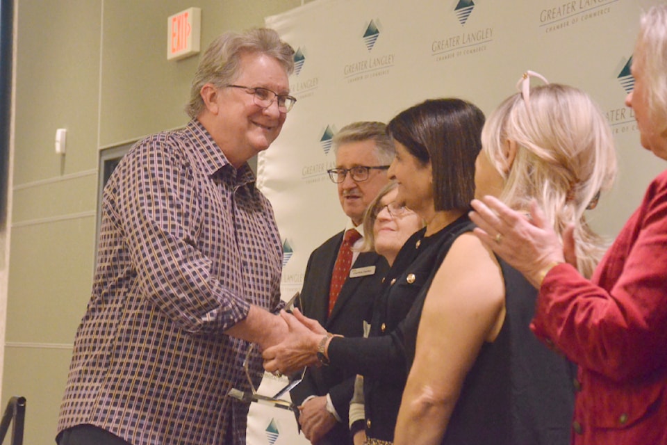 Andy Schildhorn accepted congratulations from previous winners of the citizen of the year award.