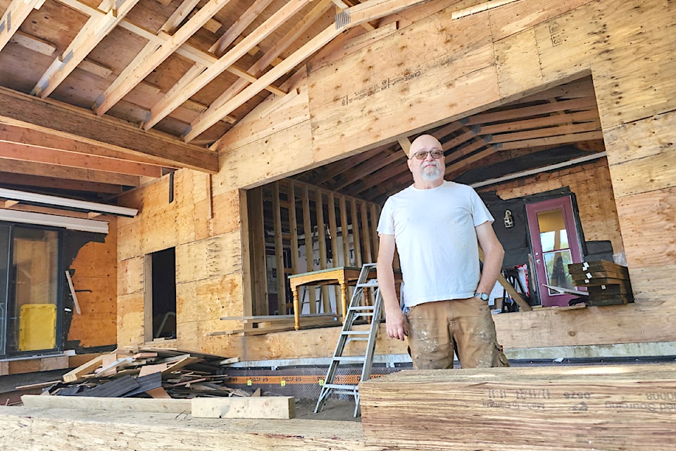 Tim Kreiter stands where an unfinished addition to the family home in Fort 91ԭ is finally being completed after a contractor abandoned renovations.