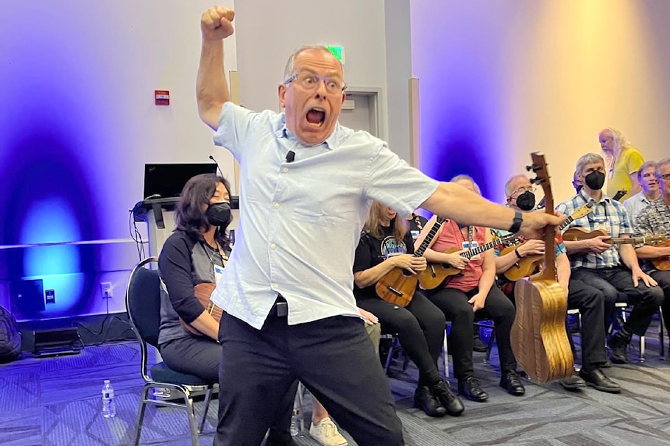 Peter Luongo (foreground) leads both youth and adult ukulele ensembles on different sides of the 49th Parallel. He's bringing them together for a concert this month in 91ԭ. 