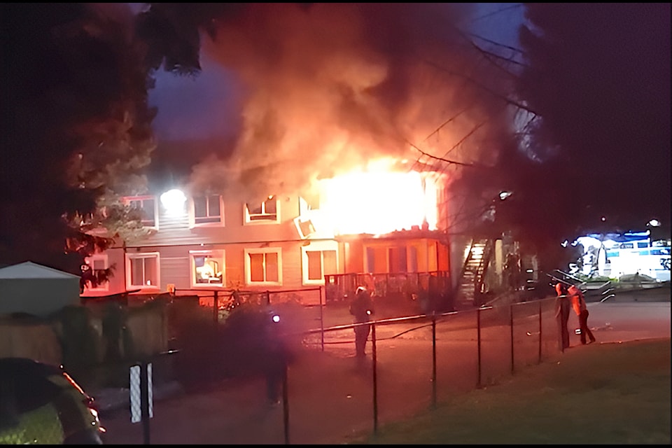 Resident Troy Olson captured firefighters battling the Kinsmen Gardens fire Sunday night. One building suffered extensive damage but no serious injuries were reported.
