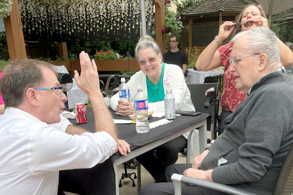 NDP Health Minister Adrian Dix chatted with 91ԭ Lodge residents and their families during an appreciation barbecue in the care home parking lot on Saturday, June 22.