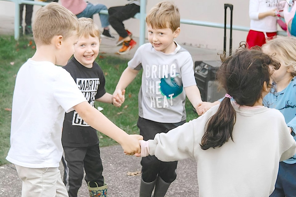 Twin brothers Weston (in black t shirt) and Bennett (grey), with classmates at their school,  celebrated an end to chemotherapy