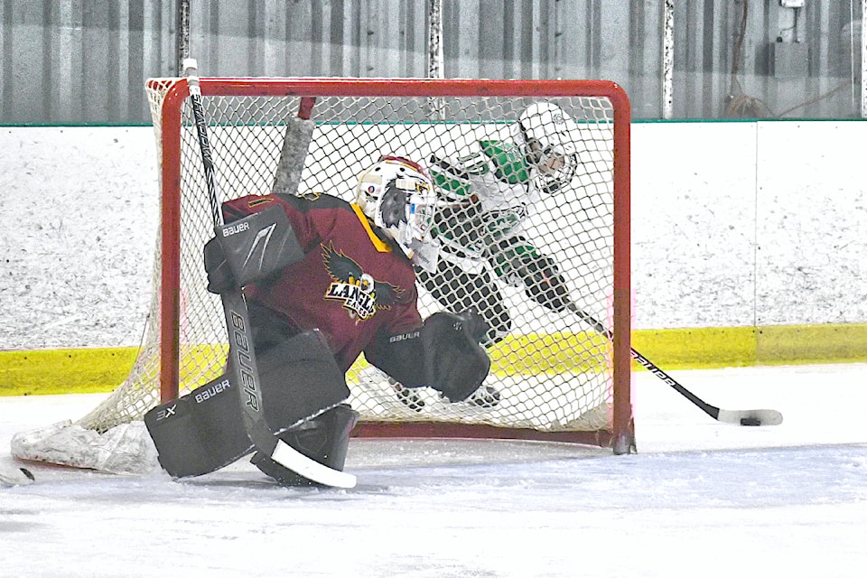 Mission forward Brendan Caravan tried to get behind 91ԭ netminder  Adam Hodgson during semifinal action in the Gil Martin Memorial tournament at the 91ԭ Sportsplex on Sunday, Nov. 10. Mission won, 7-4, and went on to take gold.