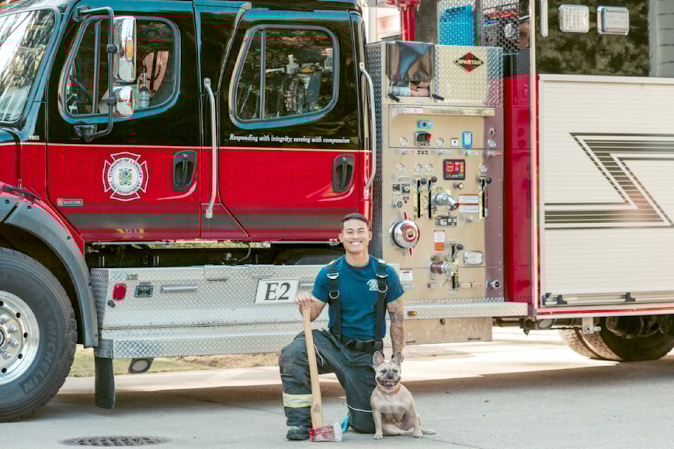 This picture of a Township firefighter and his dog is featured on the September page of the 2025 charity calendar. 