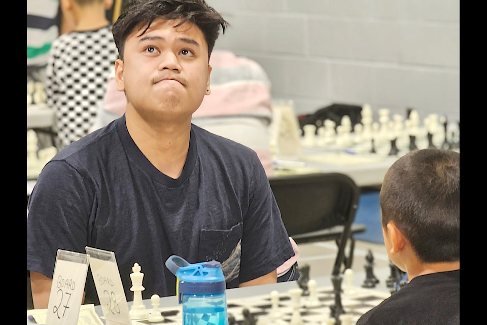 A player considered his next move. 140 competed in the 91ԭ Open chess tournament held over the Labour Day weekend at Douglas Park Community School, the biggest turnout yet.