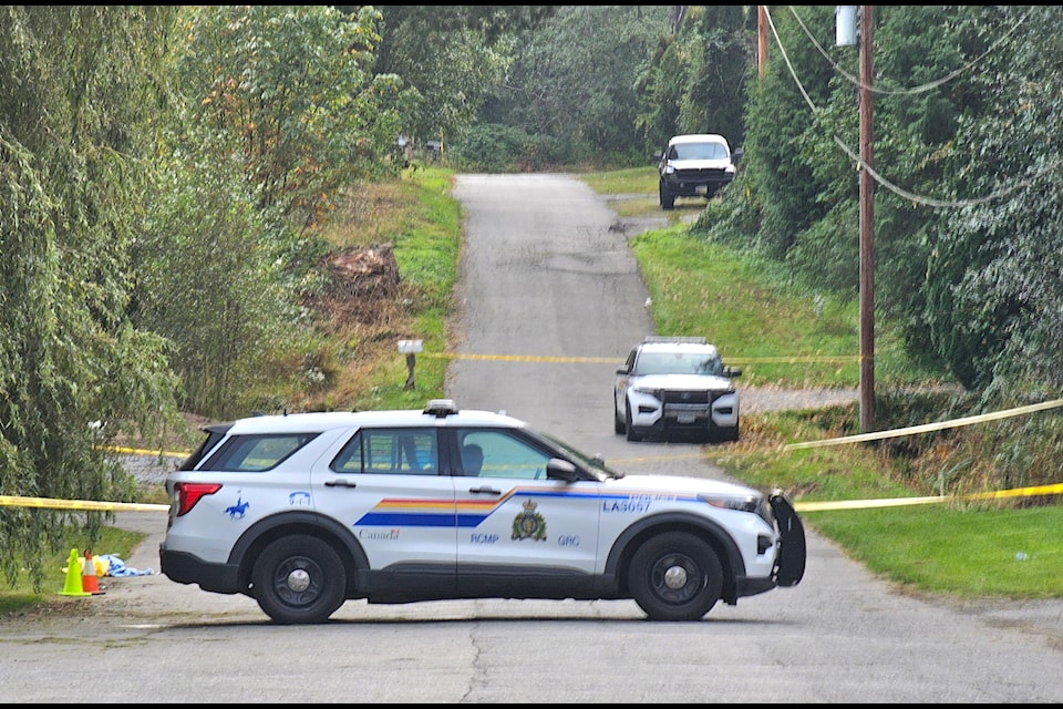Police at the scene of a gang related fatal shooting in 91ԭ last September.