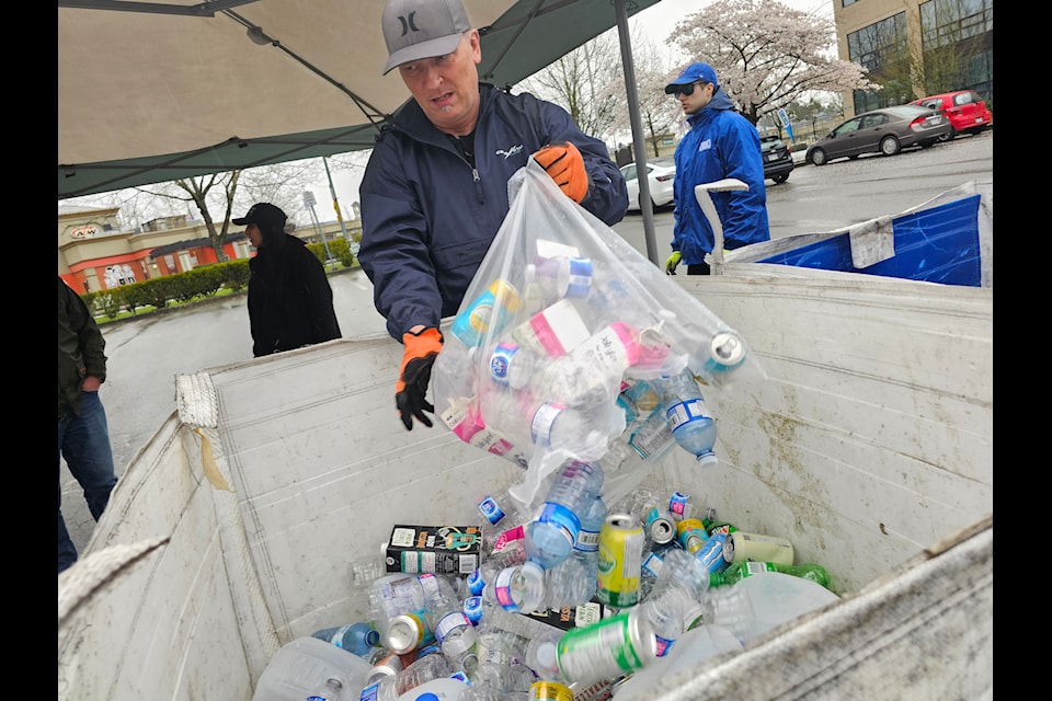 Volunteer Andy Ellison was sorting contributions. Donations for the Canucks Autism Network were being accepted Sunday at 222 and Fraser