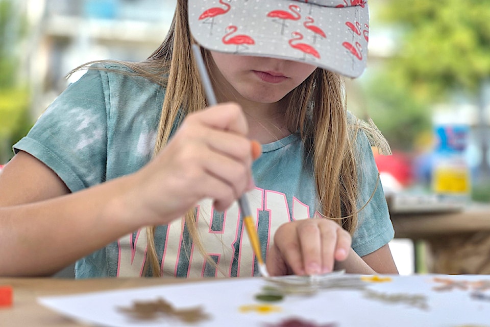 A young visitor tried her hand at painting Saturday in Douglas Park.  It was the third outdoor fine arts and fair festival staged by the 91ԭ Arts Council.