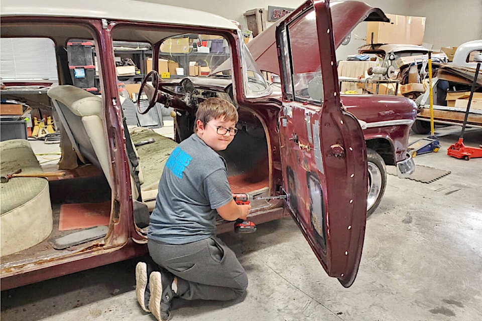 Jackson Foxley from Pitt Meadows, at work on his 1955 Chevy Bel Air, which won the first Young Guns award at Cruise-In in 2024. He will help pick the winner this year.