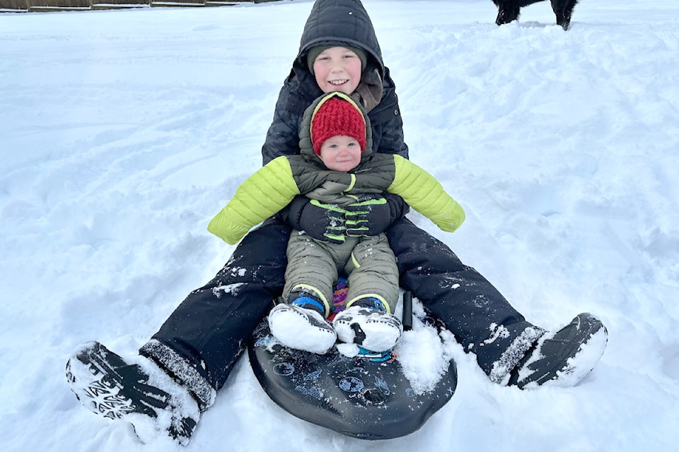 Brody Kennedy took his 18-month-old cousin, Andrew, for ride Monday, Feb. 3, 2025, at Willowbrook Park which has a small hill that attracted many families to play in the snow. 