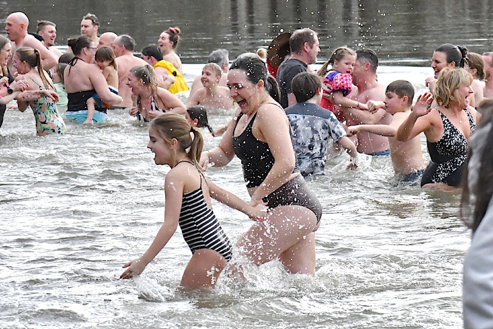 Hundreds of swimmers braved frigid waters to start the new year in Fort  on Wednesday  Jan. 1.