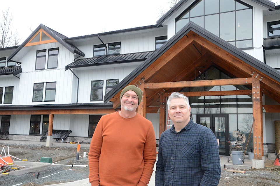 Jason Roberts, left, and Justin Froelich in front of the new residence at 91ԭ's Wagner Hills.