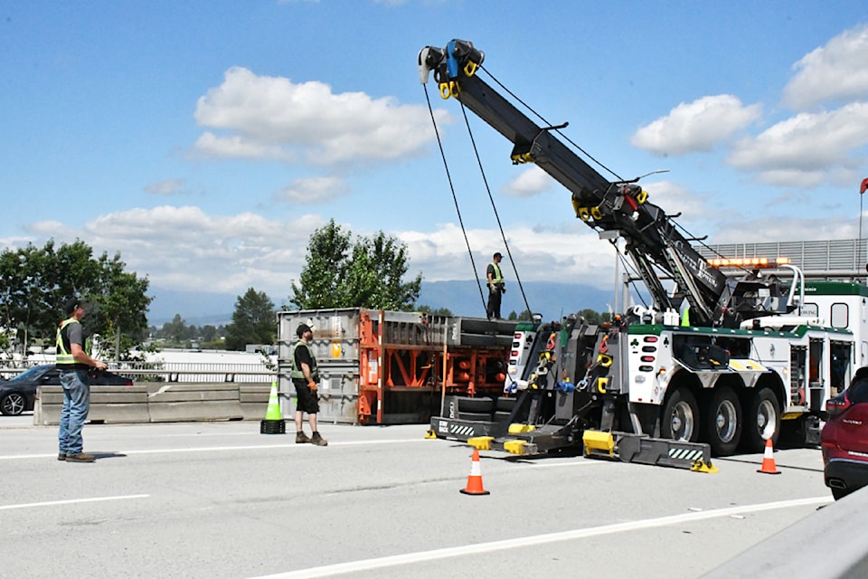 A semi-truck crashed onto its side and knocked concrete barricades out of place on Monday, July 14 on the Golden Ears Bridge.